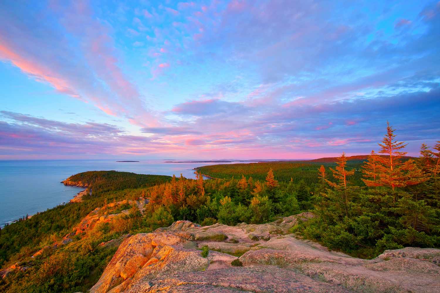 Acadia National Park Colorful sunset on the coast of Maine from a high vantage point.